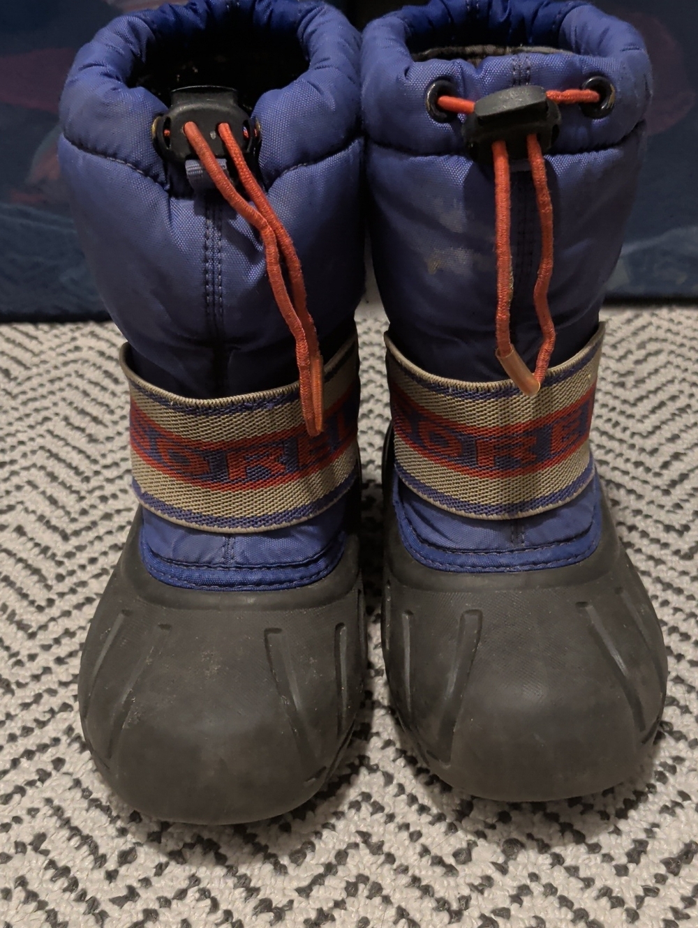 Sorel Kids Blue and Black Winter Boots with Orange Accents